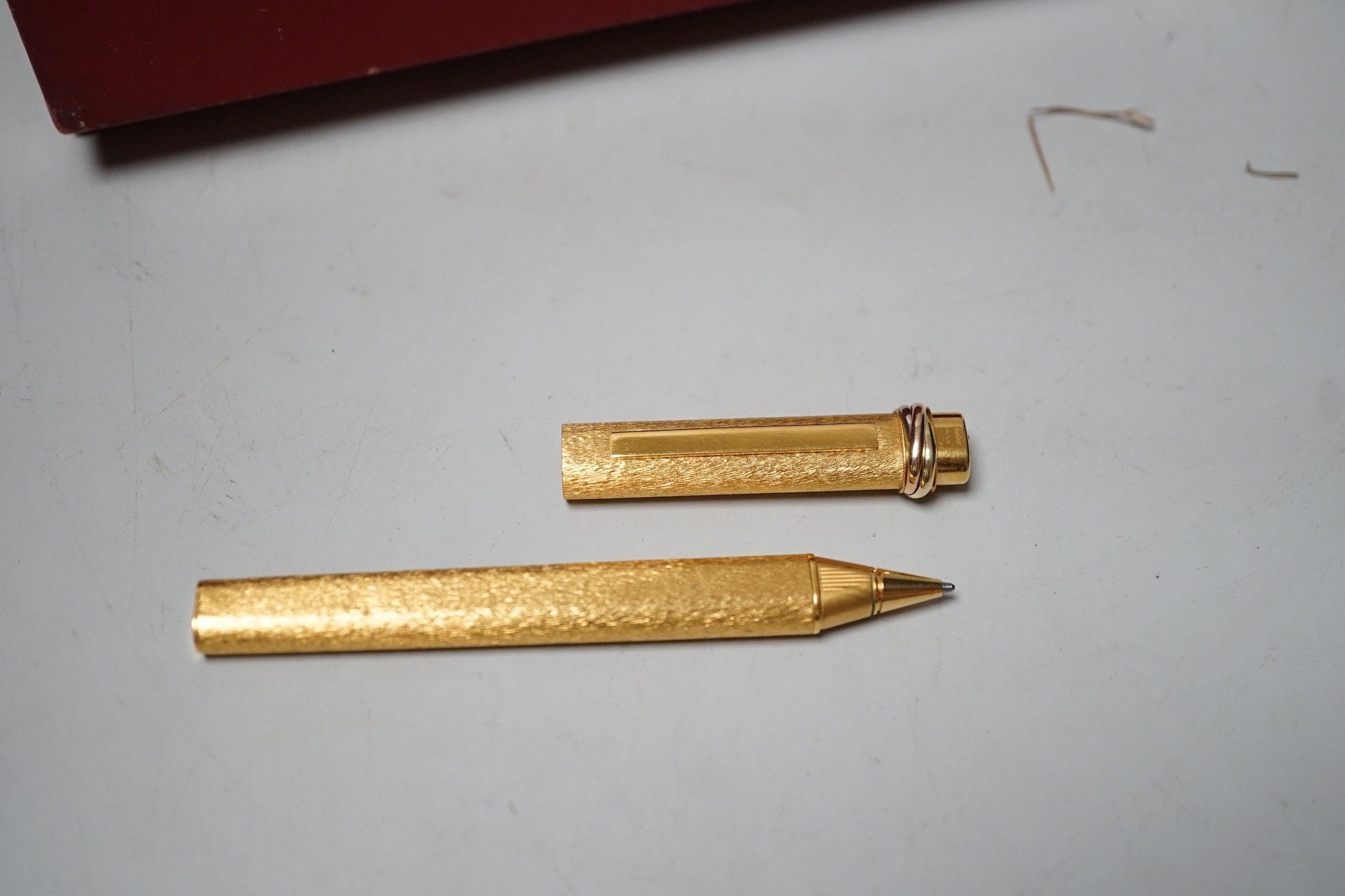 A boxed Must De Cartier ballpoint pen